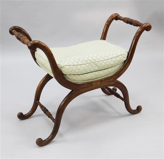 A 19th century French stained beech X frame stool, W.2ft 10in.